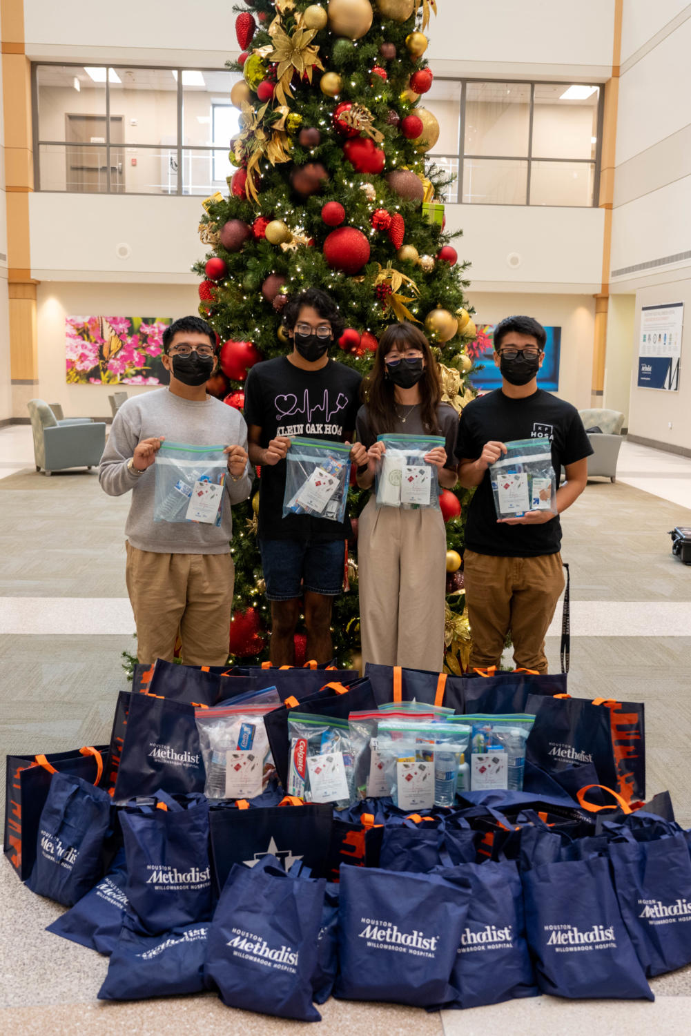 Student representatives of Klein HOSA, (left to right) Alex Merino (Cain), Sean Moparty (Oak), Jessica Chen (Collins) and Ryan Nguyen (KF) showcased the 450 survival kits that were created from donation drive Hope Haven.