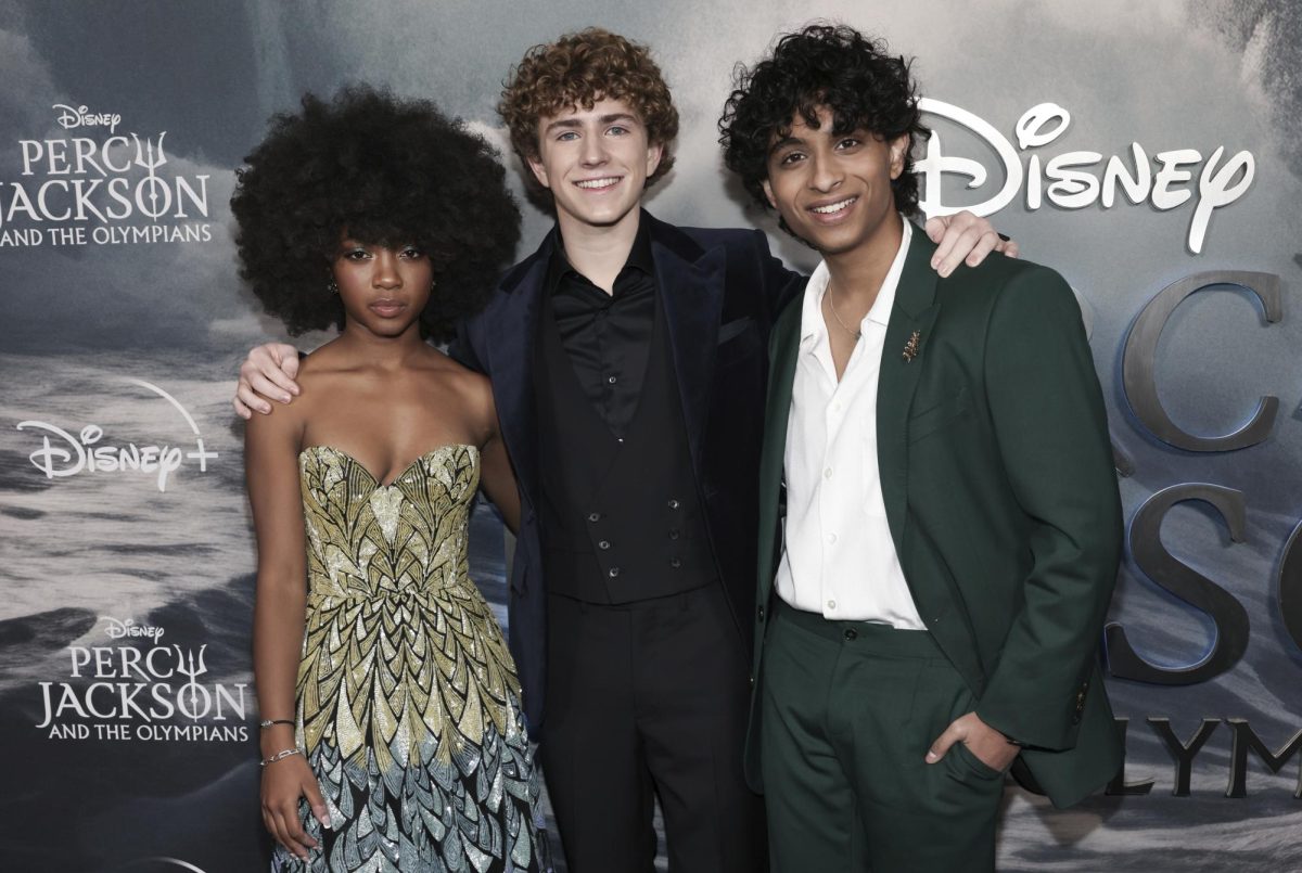 At Disney+s world premiere of Percy Jackson and the Olympians in New York, star actors Leah Jeffries, Walker Scobell, and Aryan Simhadri pose for a picture.