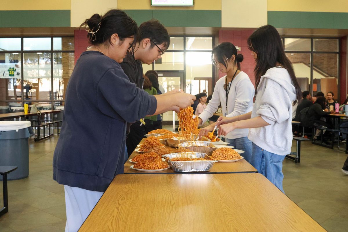 AAPISA members prepare the ramen for the upcoming challenge.

